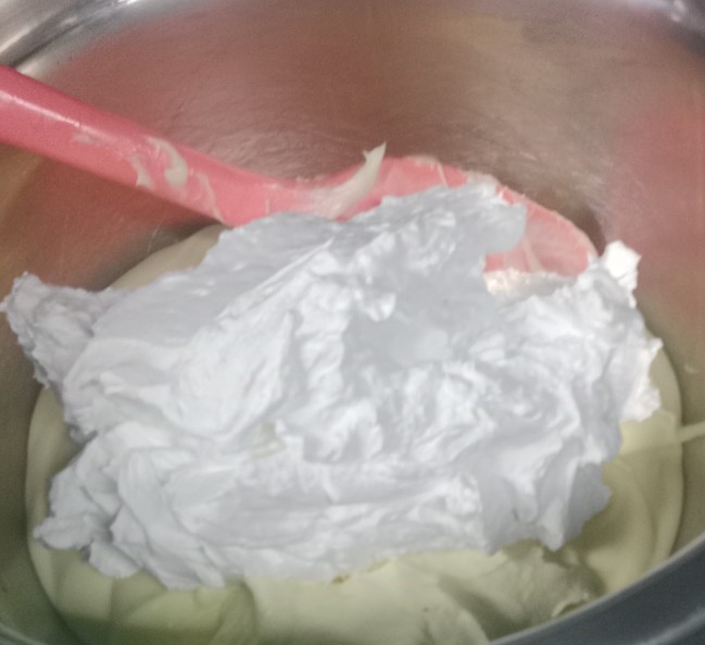 Mixing whipped cream into cream cheese for No Bake Mini Tiramisu